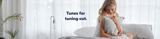 Lady lying on bed with records