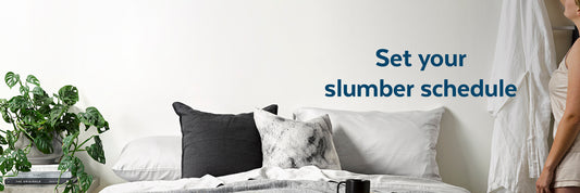 Girl hanging up robe before bed with text 'Set your slumber schedule'
