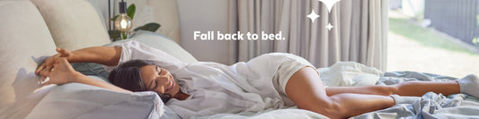 Lady stretching in bed with Fall Back to Bed text